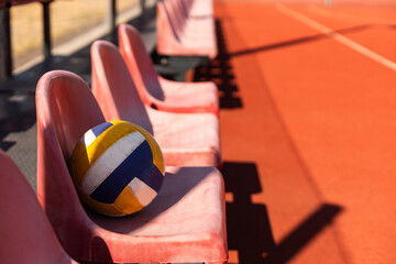 volleyball ball with blurred arena in background.