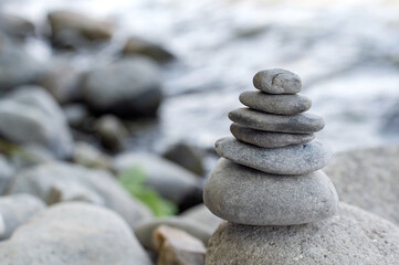 Fototapeta na wymiar Zen Stones for meditation on the bank of a mountain river