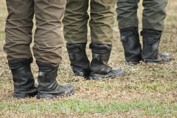 The cadets in black boots lined up neatly at the flag raising ceremony