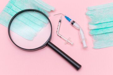 Anti Vaccine Movement and Anti Mask Concept - Broken Medical Syringe and Green Torn Medical Face...