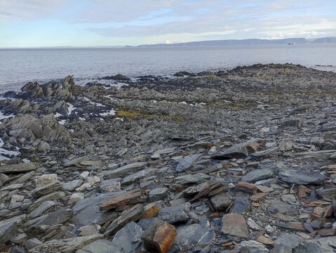 A rocky coast of Kjelvik of Mageroya Island with a view of the Barents sea, Norway