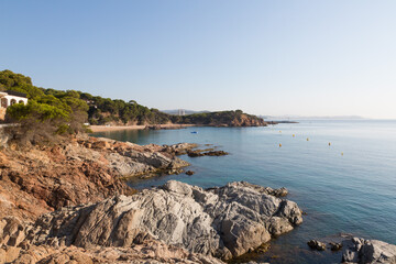 Sea and rocks under blue skies and calm seas