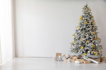 christmas tree with gifts white room new year
