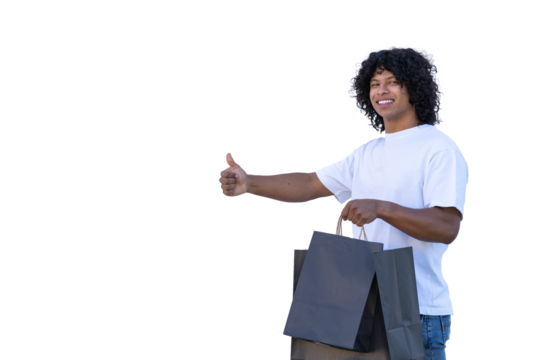 young latin man holding black shopping bags and giving thumbs up - Powered by Adobe