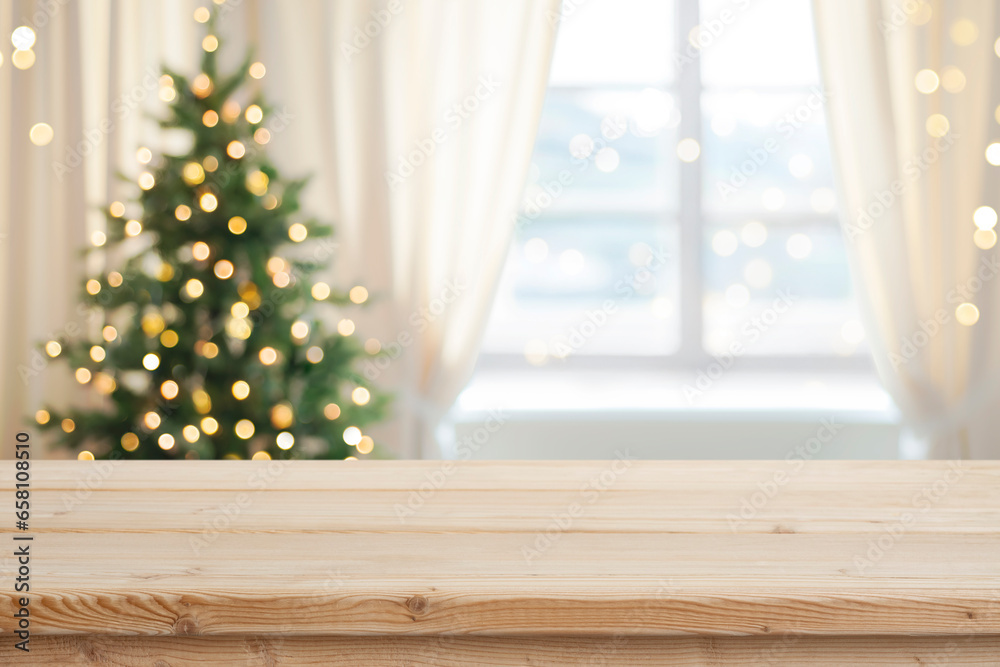 Wall mural desk space in front of window with christmas tree background