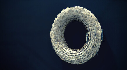 A circular decoration made from pieces of bark hangs on the wall.