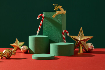Christmas decoration concept with golden accessory and empty podiums displayed on green background....