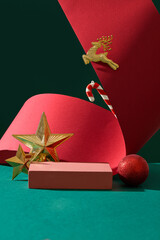 Front view of a rectangle shaped pedestal displayed with some Christmas ornaments. Christmas food...