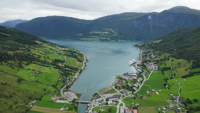 Olden Village and Cruise Ship in Nordfjord, Vestland, Norway, Scandinavia - Aerial Circling