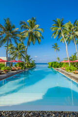 Stunning landscape, swimming pool sunny blue sky. Tropical resort hotel in Maldives. Fantastic relax peaceful vibes, leisure wellbeing chairs umbrella palm leaves. Luxury travel vacation destination