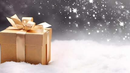 Christmas greeting card. Noel festive background. New year symbol. Gold gift box on snow. Festive background with copy space...