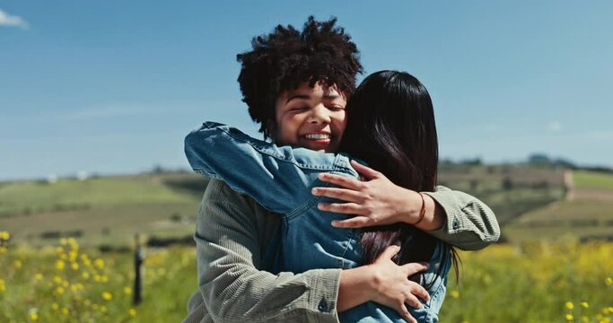 Lesbian couple, smile and women hug at field for care, love and support together at rapeseed farm. Gay, happy and girls embrace in countryside for connection, healthy relationship and trust in summer