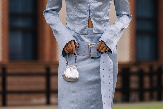 Milan, Italy - September 20, 2023: fashioner wearing Maison Margiela silver micro bag. Fashion blogger outfit details, street style