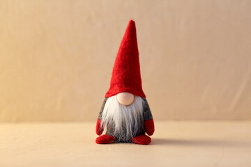 christmas, decoration and winter holidays concept - close up of gnome toy at home