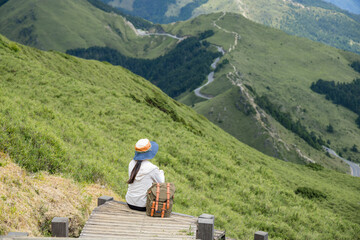 Fototapeta na wymiar Asian woman hiker rest on the mountain