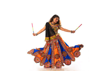 A  gujarati woman performing Raas  (dressed in a traditional Gujrati Attire) during the festival of Navratri