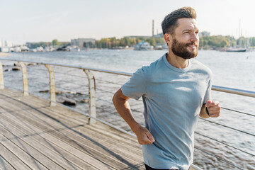 Athletic man slim and hardy warm-up cardio exercises. Motivation for a healthy and active lifestyle...