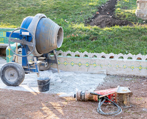blue concrete mixer.beton mixer in a construction site