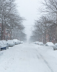 Road under the snow. Urban landscape in winter. City of Montreal under the snow. Winter storm in...
