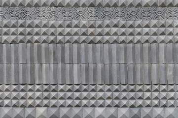 Geometric texture of gray concrete fence