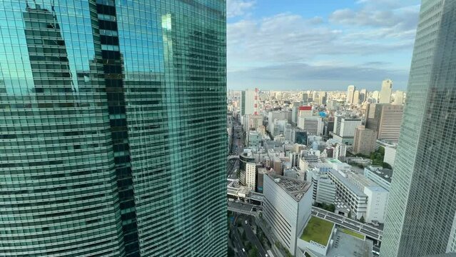 timelapse of city traffic and buildings in Shiodome, Japan