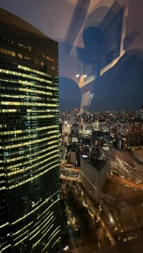 timelapse of night city traffic and buildings in Shiodome, Japan