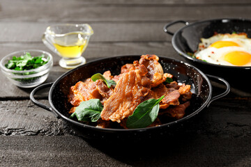 Tasty breakfast and delicious meat food concept - fried bacon