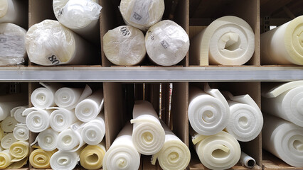 Polystyrene sealing foam in rolls for building and furniture material. - obrazy, fototapety, plakaty