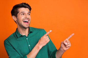 Photo of young excited man bristle promoter exclusive proposition sale fingers direct mockup interested isolated on orange color background