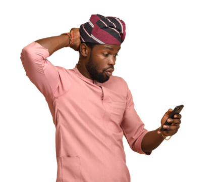 Amazed happy man, excited as he reacts to lottery winnings via mobile app feeling a great positive surprise reaction with his hands behind his head, With Copy Space on a brown isolatable backdrop