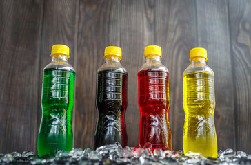 Low-angle view of Soft drink bottles Make the picture look grand or Carbonated beverages on ice, a...
