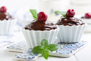 Homemade chocolate cupcakes with ganache.