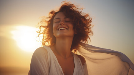 Woman smiling having a holiday fun at sunset. Cheerful woman smiling at the beach on sunset - Happy woman female having fun walking by the sea - People and happiness concept - Powered by Adobe