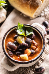 Traditional bean soup made from big beans, smoked neck, potatoes, and carrots