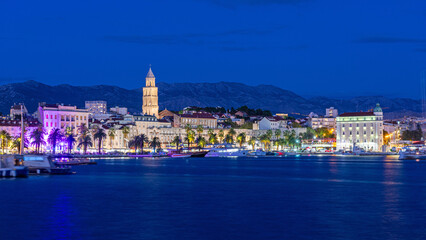 Split, Croatia. Amazing Split city waterfront panorama at night, Dalmatia, Europe. Roman Palace of the Emperor Diocletian and tower of Saint Domnius cathedral. - obrazy, fototapety, plakaty