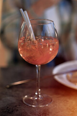 Close-up view of the glass with Cocktail Beverage Drink Inside. Alcoholic Beverage in the Glass.