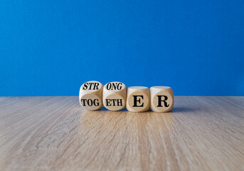 Stronger together symbol. Turned cubes and changes the word together to stronger. Beautiful wooden...