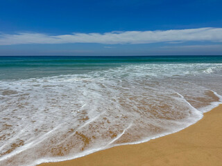 Soft Wave Of Blue Ocean On Sandy Beach. Background.