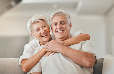 Happy senior couple, portrait and hug on living room sofa for embrace, relationship or love at...