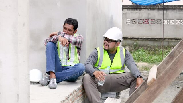 4K Asian foremen and colleagues are hopeless worried unemployed in financial crisis lose a job, labor workers man relaxing after lunch break sitting on construction site, friends relationships at work