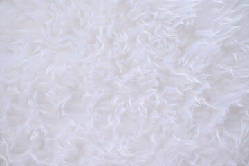 Texture of artificial white fur as a background.