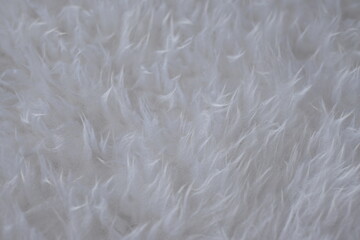 Texture of artificial white fur as a background.