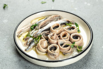 Anchovies marinated in vinegar with olive oil, Food recipe background. Close up