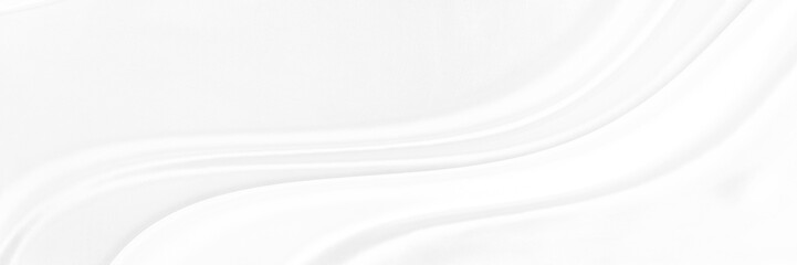 White gray satin texture that is white silver fabric silk panorama background with beautiful soft...