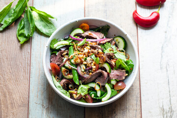 Thai salad with cucumber, herbs and beef