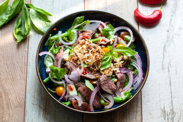 Thai salad with cucumber, herbs and beef