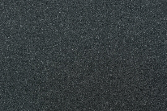 Close up of skateboard grip tape. Macro photograph of sandpaper texture. Skateboarding concept