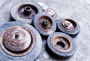 The old black rubber wheels, caster wheel, trolley wheels , demage and corossion  caster wheel.
