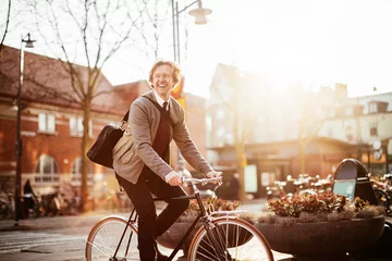 Foto op Canvas Mature businessman commuting to work on a bicycle in the city © Geber86