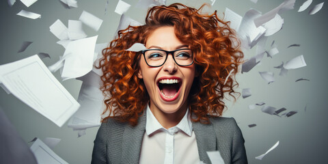 Humorous redhead businesswoman in glasses losing her papers on white background. - obrazy, fototapety, plakaty